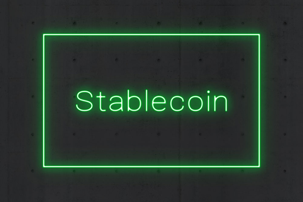 Uma ilustração com a palavra “stablecoin” escrita. 